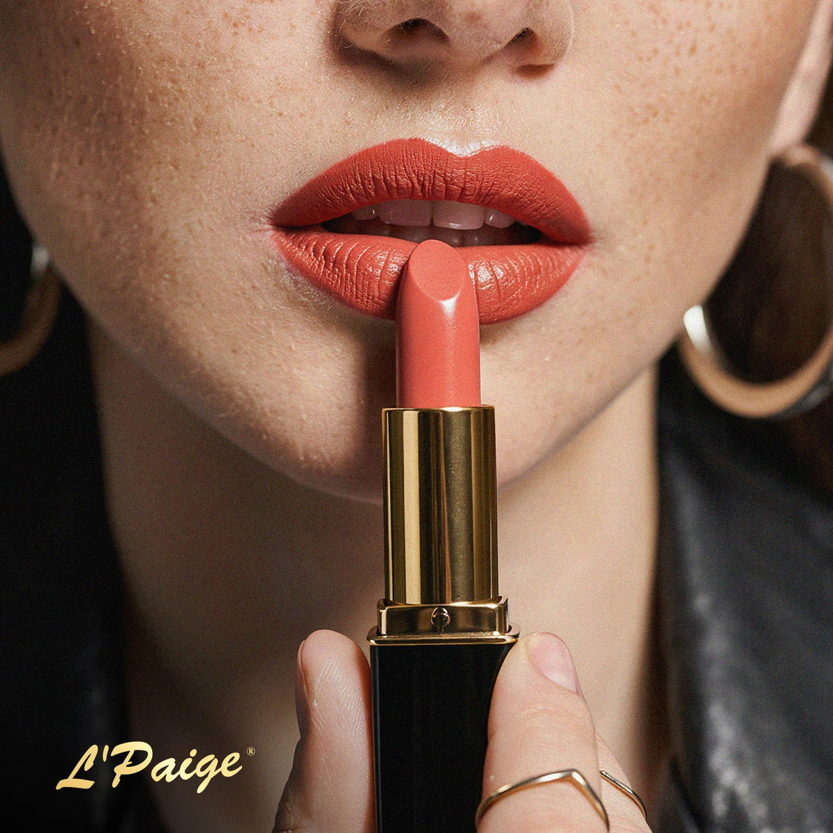 L'Paige lifestyle summer look with model wearing peach coral for warm glow