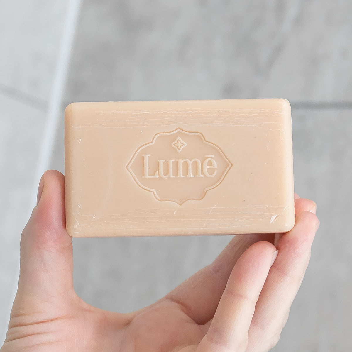 Lume Clean Tangerine four bars stacked to illustrate pack of four convenience and travel-ready supply