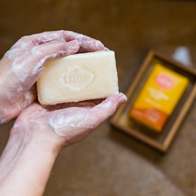 Lume creating thick lather in hand for smooth, moisturizing cleansing