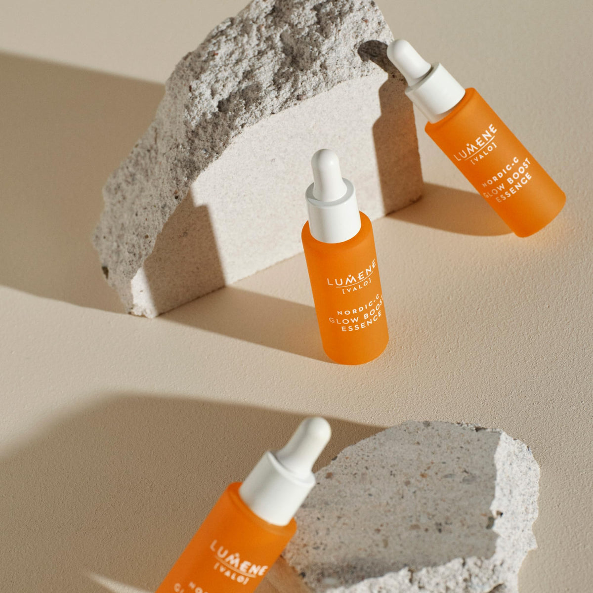 lumene serum placed next to moisturizer in a bathroom scene for layered skincare routine