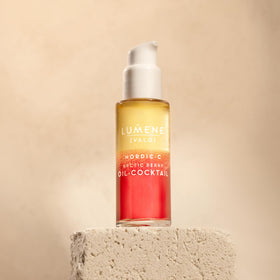 Lumene bottle with mixed bi-phase oil and water showing balanced hydration