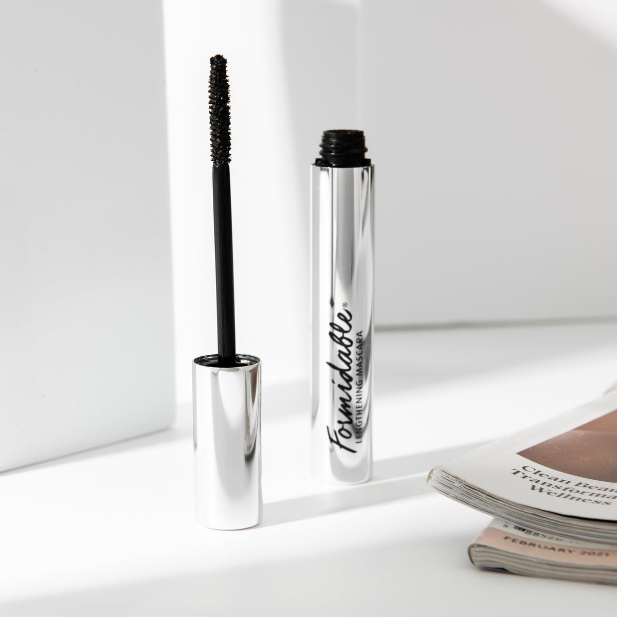 Lune+Aster next to a ruler showing compact size and travel-friendly benefit