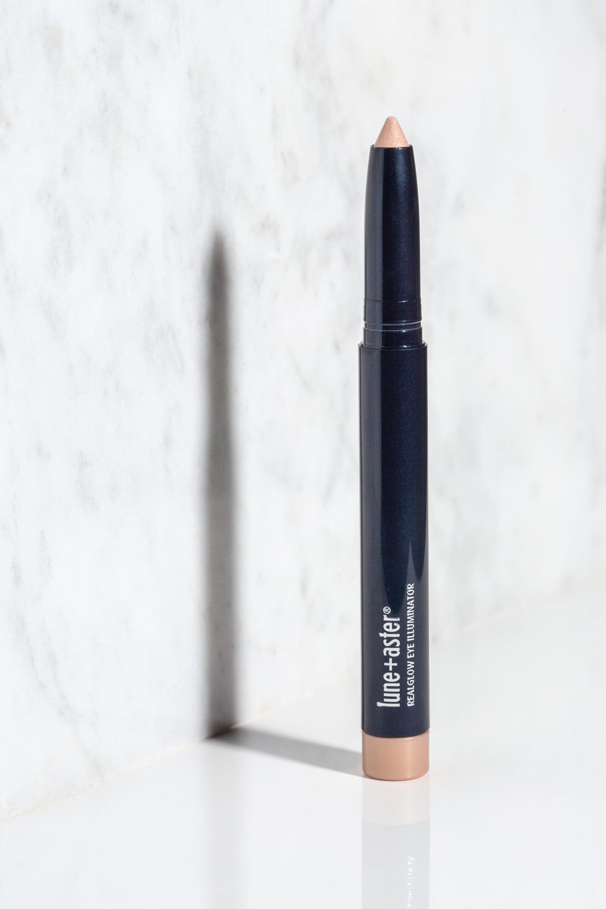 Lune+Aster crayon in a makeup bag lifestyle shot for quick on-the-go touch-ups