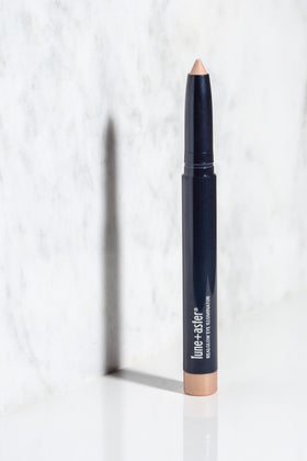Lune+Aster crayon in a makeup bag lifestyle shot for quick on-the-go touch-ups