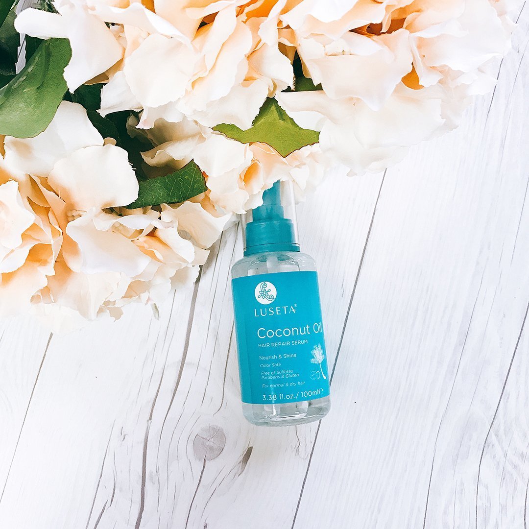 L LUSETA bottle on bathroom shelf staged with towels showing daily styling and hydration benefits