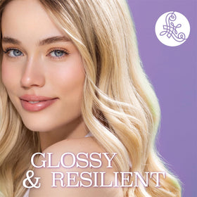 Luseta spray being applied to damp hair to protect before heat