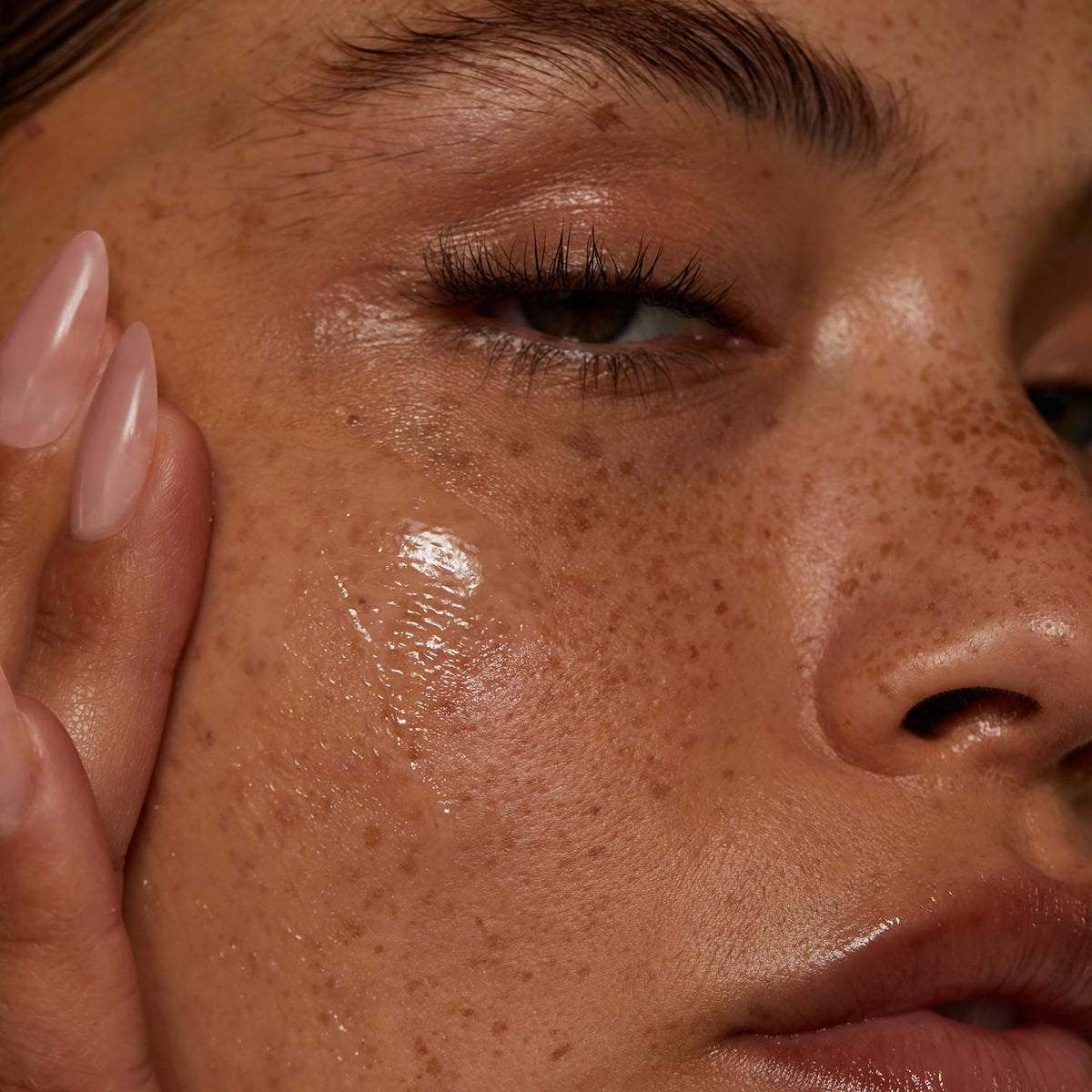 Lux Unfiltered balm emulsified with water on fingertips, shows rinse-ready texture