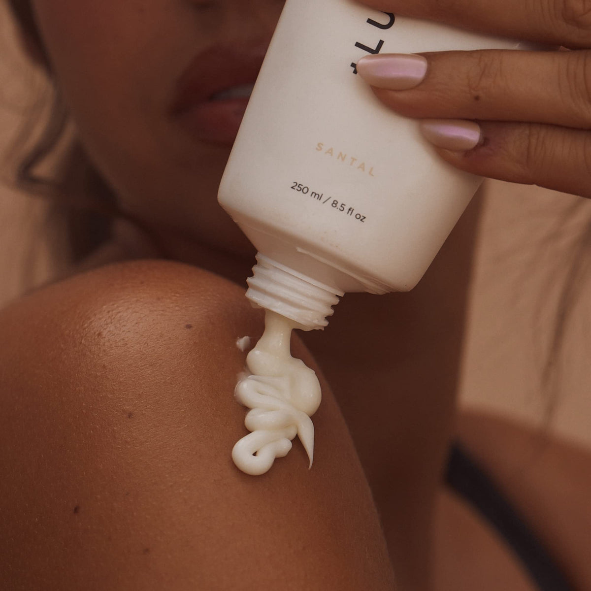 Lux Unfiltered pump dispensing lotion into hand showing quick absorption benefit