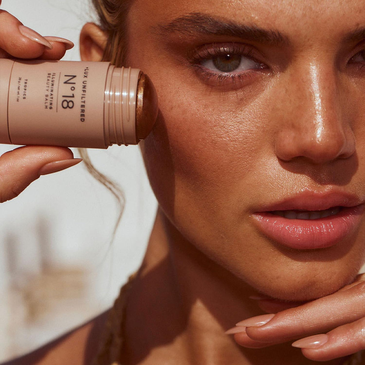 Lux Unfiltered N°18 being blended with fingers for seamless dewy finish