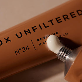 Lux Unfiltered on a bathroom vanity styled to suggest everyday self-care benefit