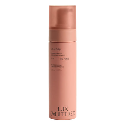 Lux Unfiltered N°36 front bottle showing packaging and deep tan benefit
