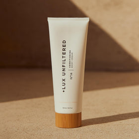 Lux Unfiltered bottle on bathroom shelf in routine setting suggesting daily moisturizing use