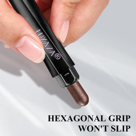 LUXAZA sticks beside a coin to show compact size and travel convenience