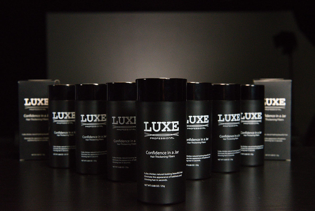 LUXE fibers packed in travel pouch emphasizing portability and touch-ups