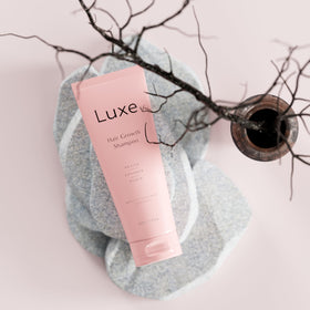 LUXÉ shampoo lather on scalp demonstrating gentle cleansing and nourishment