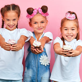 Lyrow labeled cards reading HOWDY and Let's Go Girls with scrunchies for parties