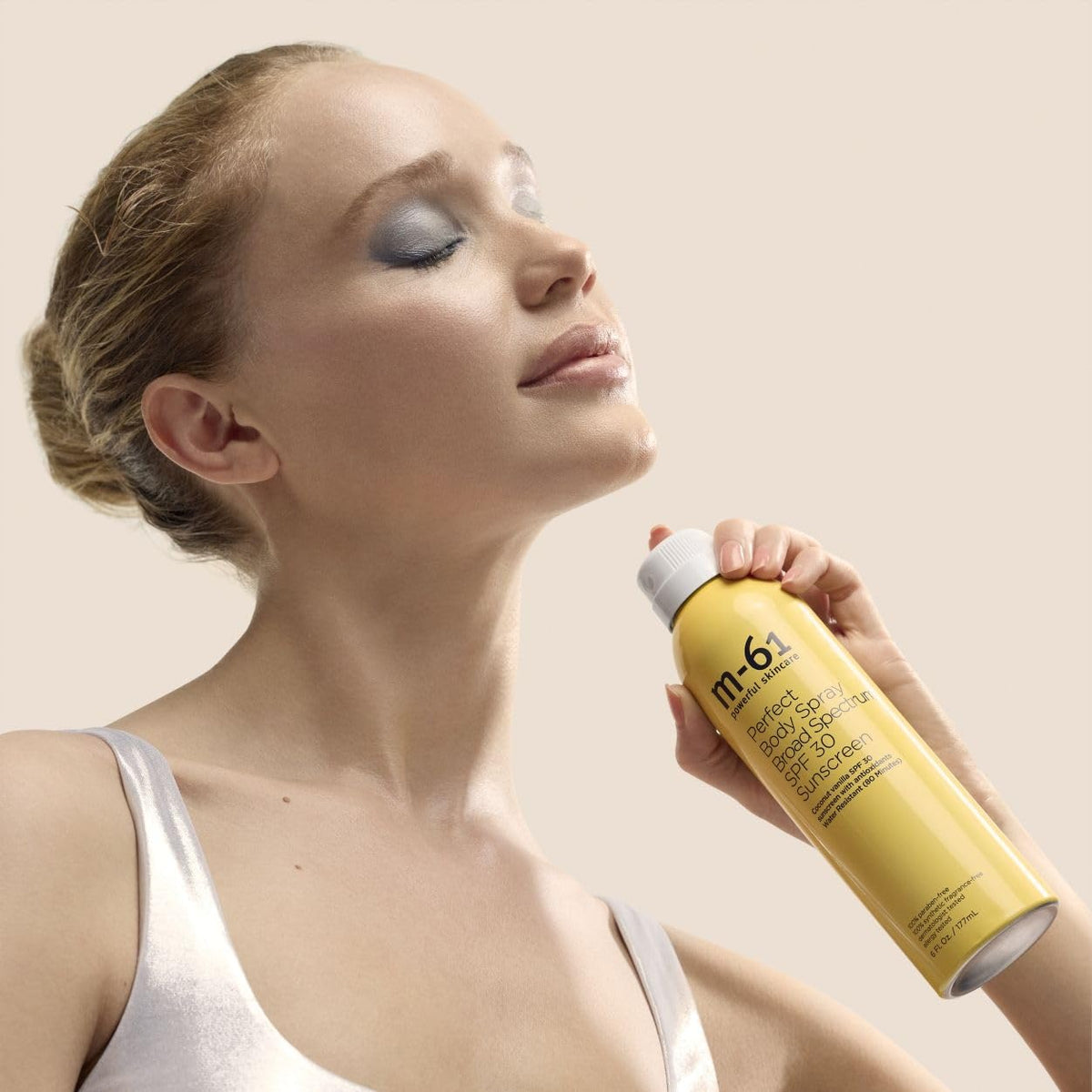 m-61 close-up of fine clear mist texture revealing even coverage benefit