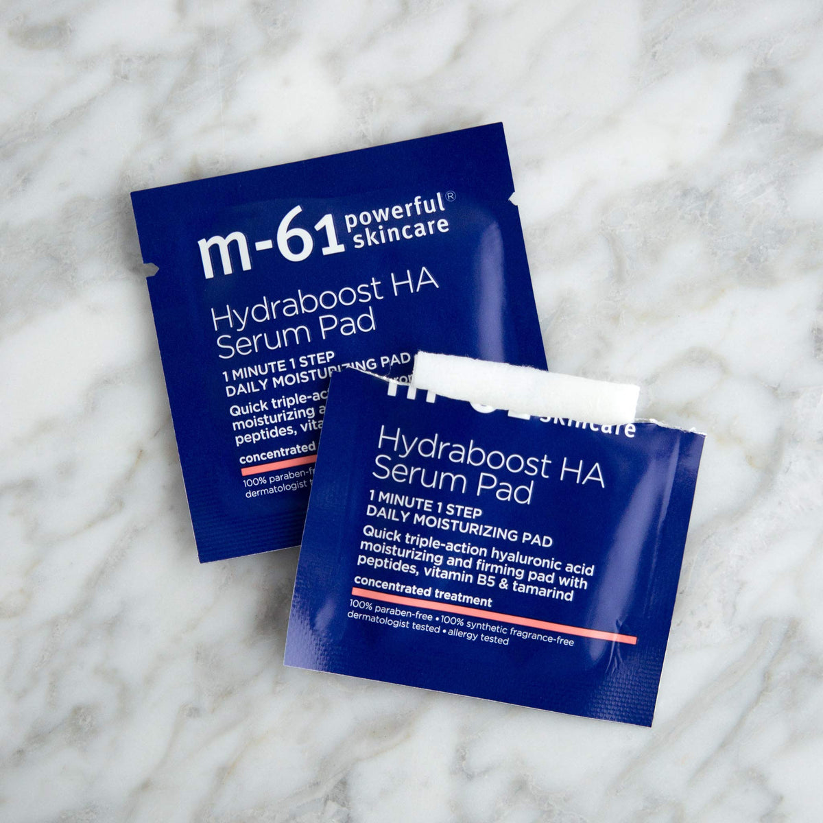 m-61 pad in hand illustrating size and easy one-minute use