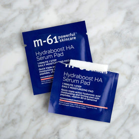 m-61 pad in hand illustrating size and easy one-minute use