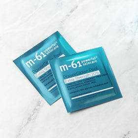m-61 pad being wiped across back of hand demonstrating ease and efficient exfoliation