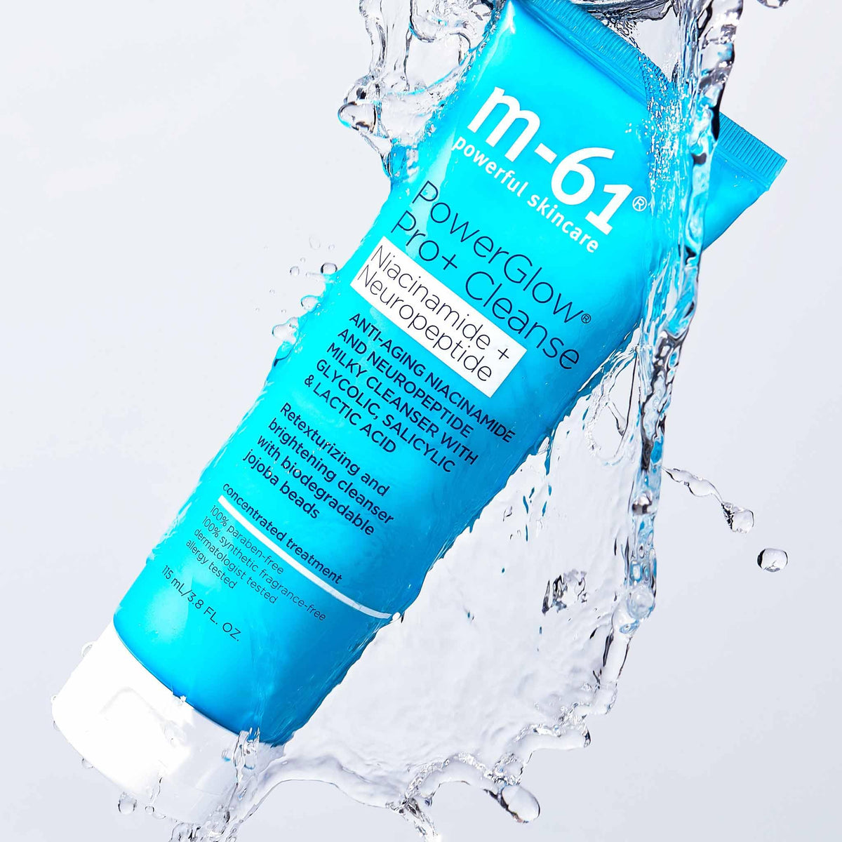 m-61 bottle in hand showing 4 fl oz scale for travel-friendly size
