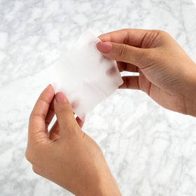 m-61 pad texture close-up revealing saturated exfoliating surface for effective resurfacing