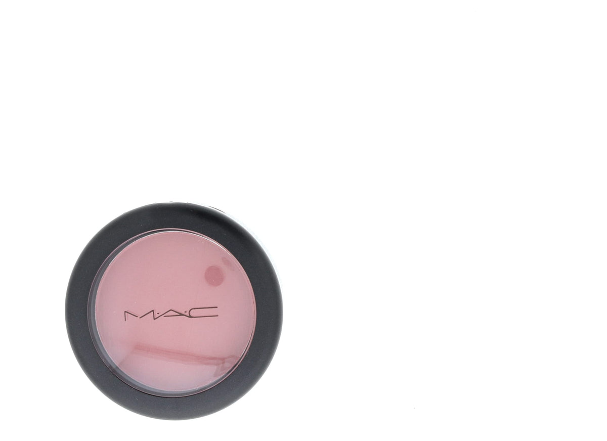 MAC compact held in hand illustrating size and travel-friendly benefit
