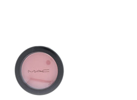 MAC compact held in hand illustrating size and travel-friendly benefit