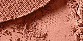 MAC Coppertone brush swatch on skin demonstrating blendable color payoff and warmth
