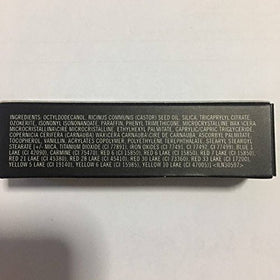 MAC lipstick bullet close-up displaying creamy texture and pale peach-beige tip for smooth application