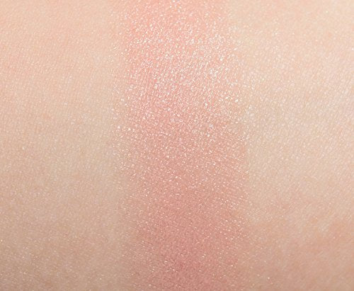 MAC lipstick swatch on arm revealing muted peach-beige color payoff and buildable coverage