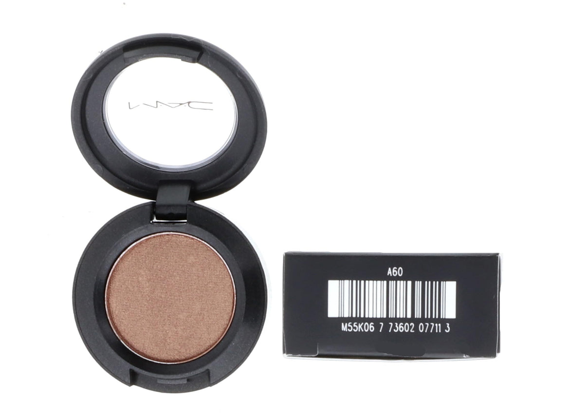 MAC Woodwinked next to ruler indicating compact 1.5g size and travel-friendly benefit
