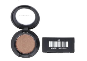 MAC Woodwinked next to ruler indicating compact 1.5g size and travel-friendly benefit
