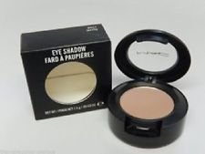 MAC eyeshadow front packaging showing champagne-gold shimmer and wearable glow