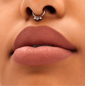 MAC Locked Kiss on lips lifestyle shot showing MAC color longevity and polished look