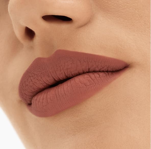 MAC Locked Kiss size comparison with hand showing compact travel-friendly lipstick