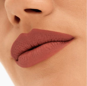 MAC Locked Kiss size comparison with hand showing compact travel-friendly lipstick
