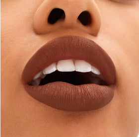 MAC Locked Kiss applied on lips in lifestyle setting demonstrating long-wear benefit and finish