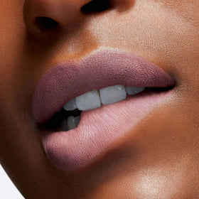 M·A·C Locked Kiss beside a face mask to illustrate reduced transfer benefit