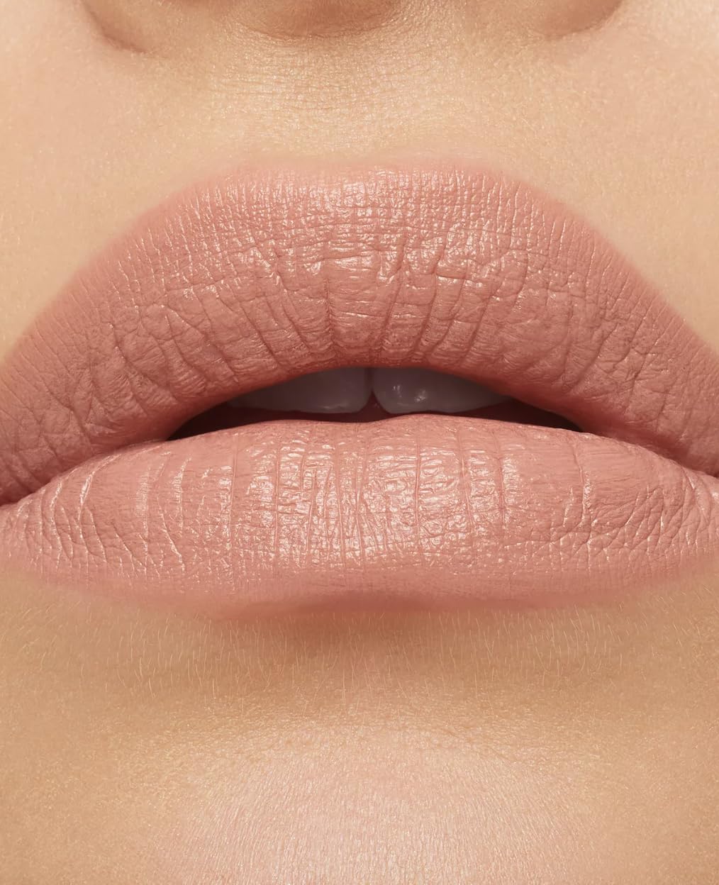 MAC Macximal Honeylove on lips lifestyle shot emphasizing polished look