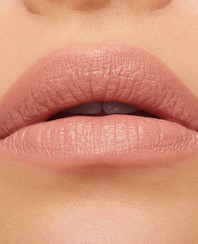 MAC Macximal Honeylove on lips lifestyle shot emphasizing polished look