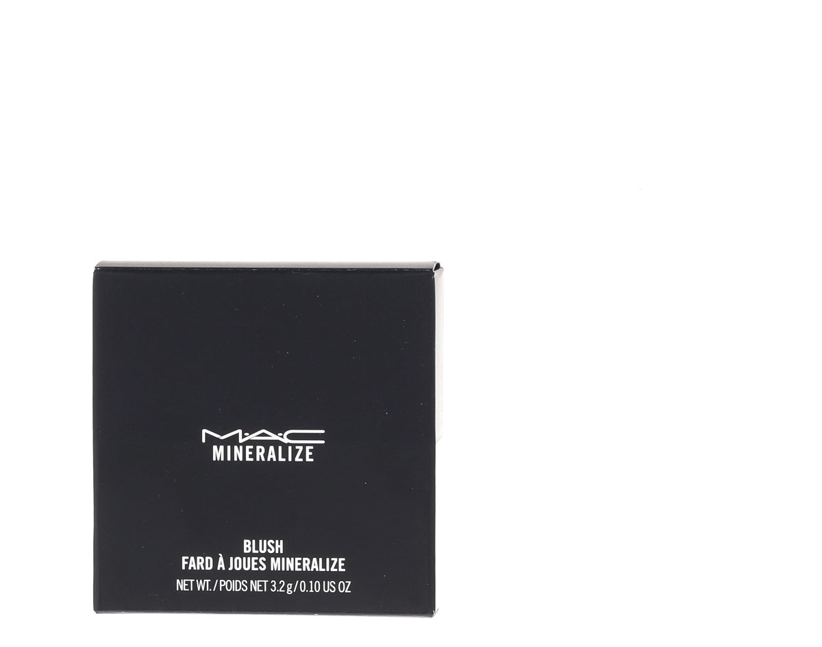 MAC mineralize blush on model cheeks illustrating natural glow benefit