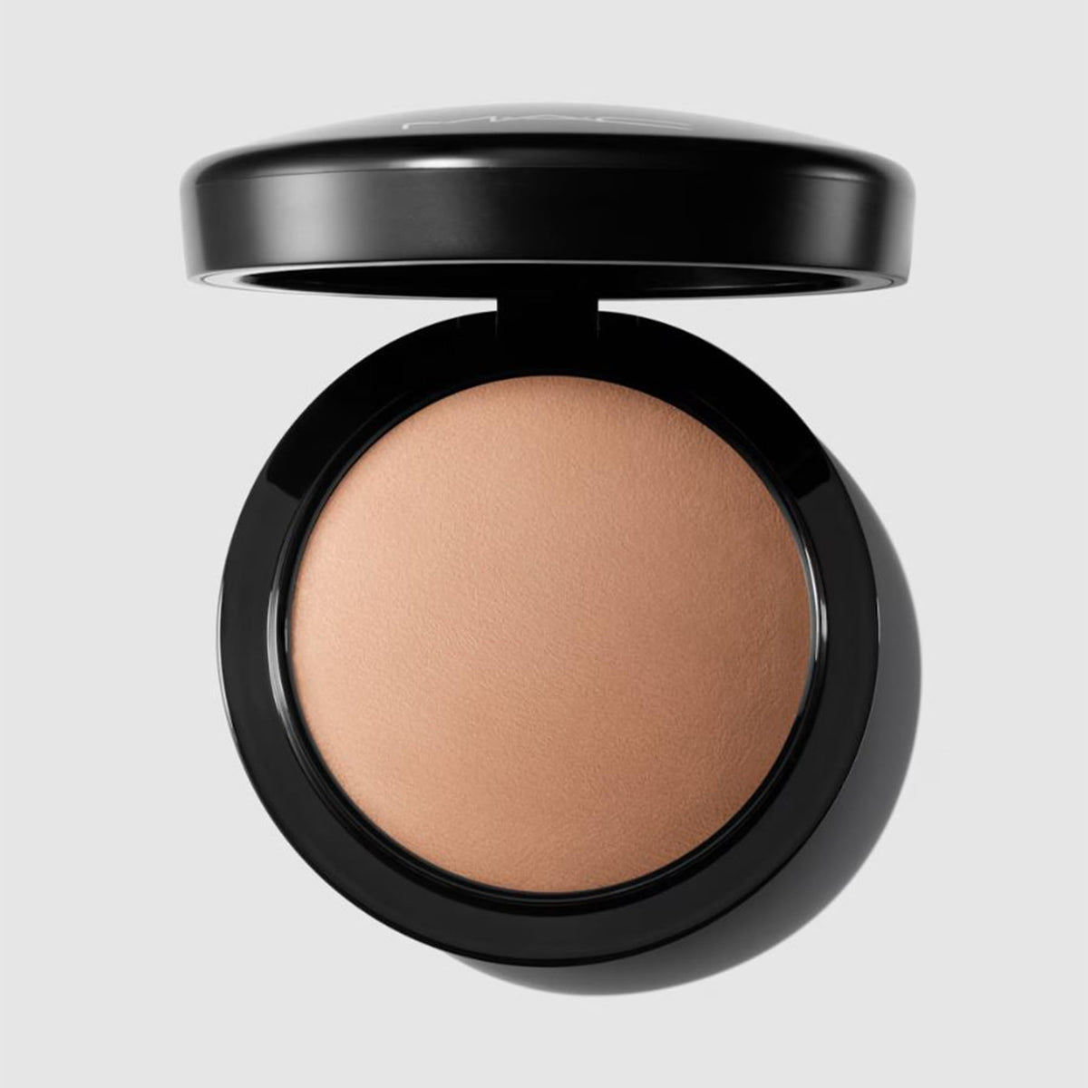 MAC domed pan close-up showing baked texture for even, lightweight coverage