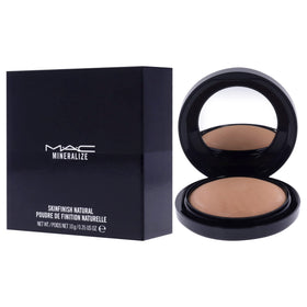 Model applying MAC powder on cheek for natural radiance and long-lasting makeup