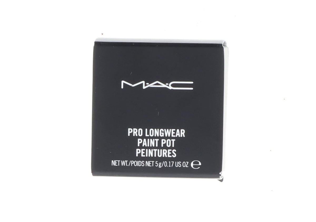 MAC Paint Pot Soft Ochre next to ruler showing scale and compact size for travel-friendly convenience
