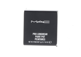 MAC Paint Pot Soft Ochre next to ruler showing scale and compact size for travel-friendly convenience