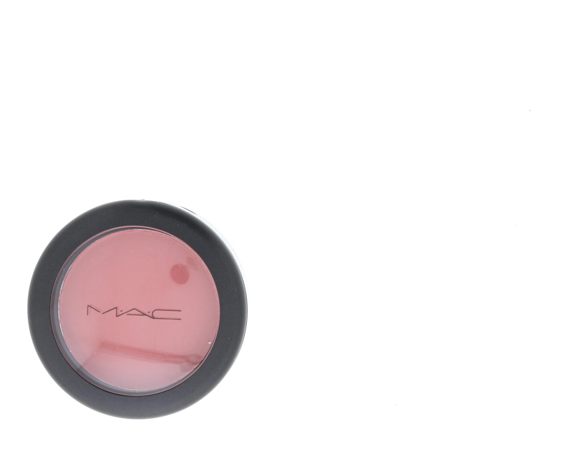 MAC Pinch Me on vanity with accessories illustrating travel-ready compact and everyday use