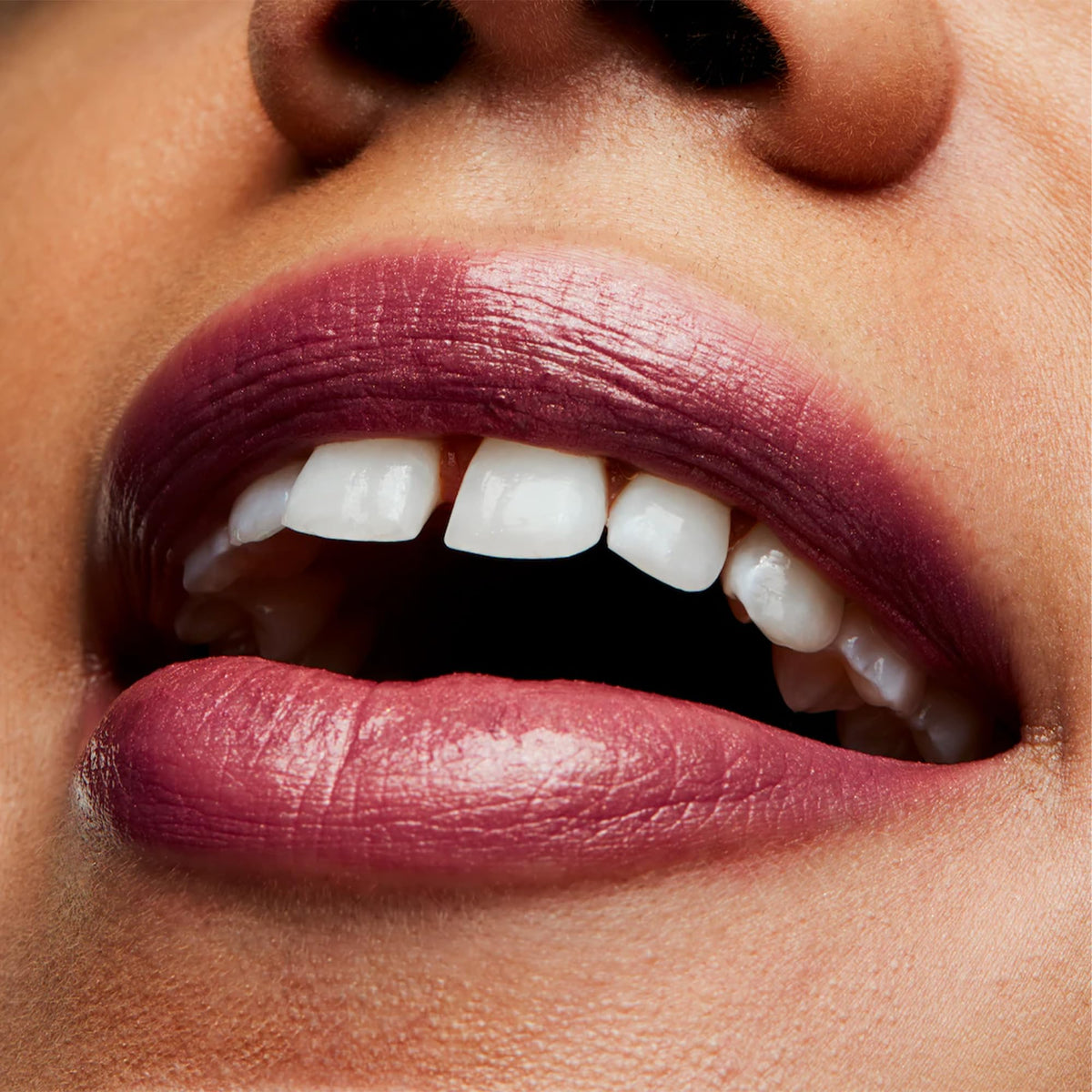 MAC Plum Dandy on lips lifestyle shot illustrating polished semi-lustrous look