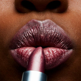 MAC Plum Dandy swatch on skin demonstrating buildable plum coverage