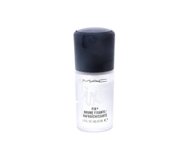 MAC mini bottle in hand demonstrates compact travel size and on-the-go convenience
